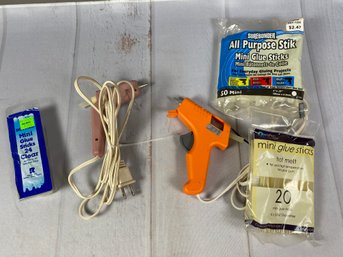 Pair Of Mini Glue Guns And Packages Of Mini Glue Sticks