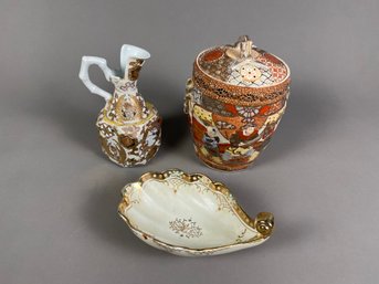 3 Pieces Of Porcelain Pieces With Moriage Design, Including A Lidded Jar, Pitcher 7 Handled Dish