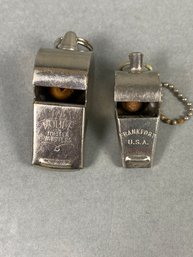 Pair Of Metal Whistles With Cork Balls, Frankfort And Nobel
