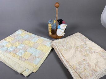 Two Vintage Baby Quilts And A Wooden Spinning Toy With Cats