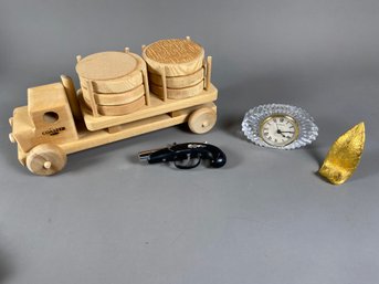 Miscellaneous Items Including A Wooden Truck With Coasters, Shannon Crystal Table Clock, & Pistol Lighter