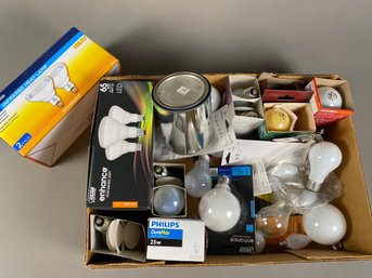 Large Lot Of Light Bulbs And An Empty Replacement Paint Can