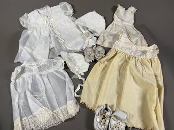 Collection Of Vintage Baby Clothes Including Leather Toddler Shoes, Bonnets, & Christening Dresses