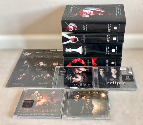 Collection Of Twilight Saga Books, Soundtracks, And Magnets
