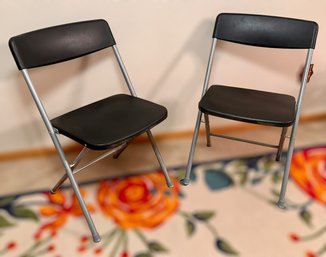 Two Black Folding Chairs