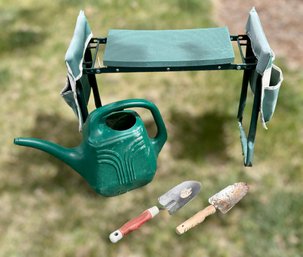 Assortment Of Gardening Tools And Garden Bench