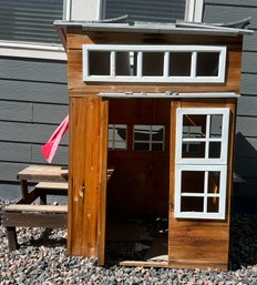 Wooden Play House With A Kitchen And Picnic Table Built Into