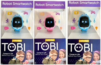 Unused Light Blue And Pink Tobi Robot Smartwatches For Kids W/ Watchband, Clips, Stand, & USB Cable - Lot Of 3