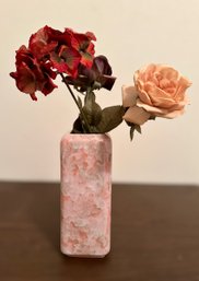 Exquisite Rose And Geranium Arrangement In A Beautiful Natural Pink Stone Vase