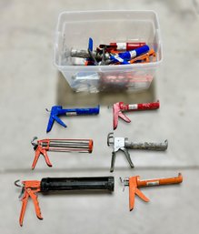 Assortment Of Multi-colored Caulking Guns W/ Varying Sizes