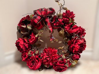 Lovely Red Floral Wreath With A Plaid Ribbon
