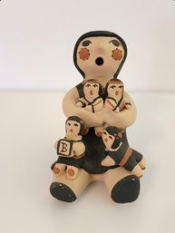 Hand Sculpted Native American Pottery Of A Storyteller Holding Four Children By Lyda Toya Jemez Pueblo