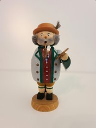 Wooden German Figurine By Seiffener Volkskunst Of Man Smoking And Holding A Pretzel