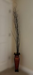 Tall Embossed Red Floral Vase With A Black Twig Arrangement