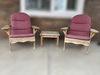 Outdoor Patio Adirondack Chairs With Dusty Rose Colored Cushions And Coffee Side Table