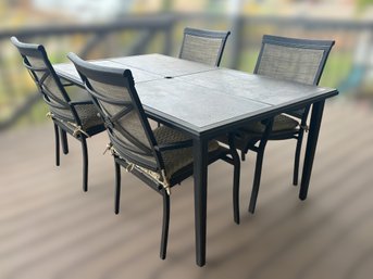 Beautiful Stone Tile Out Door Patio Table And Matching Chairs With  Textured Woven Cushions