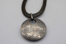 Antique Textured Circular Pendant With Intricate Chain  Mysterious Metallic Necklace  Vintage Fashion Access