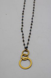 Vintage-Inspired Elegant Chain Necklace With Interlocking Gold-Tone Circles Pendant