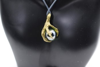 Artisan Gold-Tone Talon Pendant With Marbled Orb Necklace