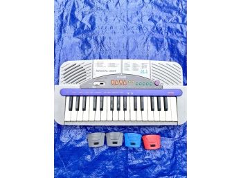CASIO Children's Song Piano - Battery Operated - 4 Small Clip-On Head Lights Included!! Item#159 GAR