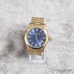 AN EXTRA LARGE AND FANTASTIC MICHAEL KORS GOLD TONE WATCH WITH BLUE DIAL MK7049