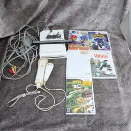 ONE NINTENDO WII VIDEO GAME SYSTEM WITH CONTROLLERS, WIRES AND 5 ASSORTED GAMES