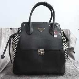 BRAND NEW WITH TAGS AND SUPER COOL BLACK GRAINED LEATHERETTE AND ZEBRA PRINT SIDE X-LARGE ROLLING BAG
