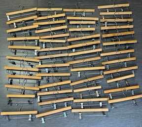 EXPENSIVE LOT OF APRROX. 47 NEAR MINT HENRY HANGER CO. NASHUA, NH. SOLID WOOD CLIP PANT HANGERS