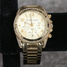 #10 NEAR MINT AND EXTRA LARGE MICHAEL KORS YELLOW GOLD TONE CHRONOGRAPH WATCH WITH DIAMANTE BEZEL