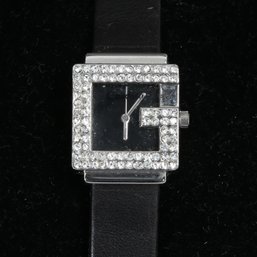 #13 AN INCREDIBLE CARDINI STAINLESS STEEL WATCH WITH GUCCI ESQUE CRYSTAL ENCRUSTED G ON BLACK LEATHER STRAP