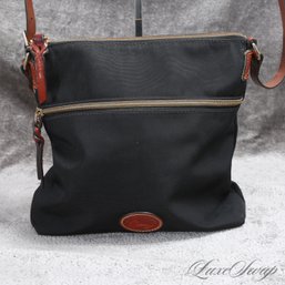 NEAR MINT DOONEY AND BOURKE BLACK MICROFIBER AND BROWN LEATHER TRIM CROSSBODY BAG