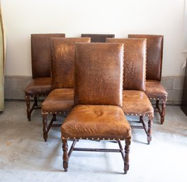 A Set Of Six Palecek Embossed Leather Dining Chairs