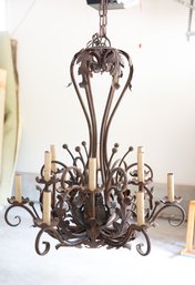 An Ornate Iron 12 Bulb Chandelier