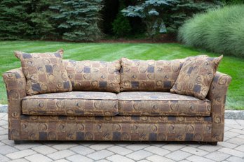 An Umber Sienna And Brown Upholstered Sleeper Sofa