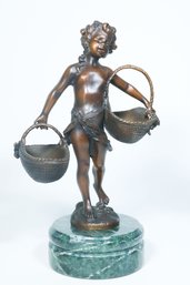 A Bronze Sculpture Of A Girl Carrying Baskets