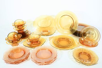 An Assembled Group Of 43 Amber Glass DInnerware