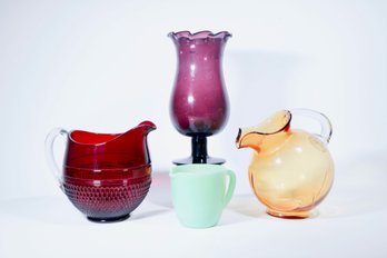 A Collection Of 4 Pieces Colored Glass Table Articles