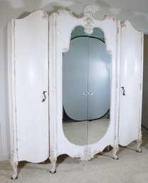 A Distressed Painted Three Part French Armoire