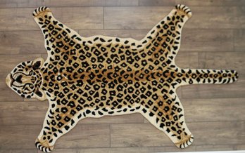 A Heavy Wool Leopard Form Rug