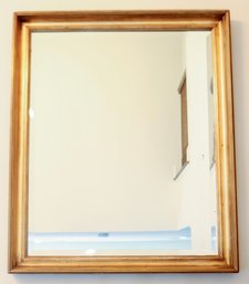 A Beveled Glass Mirror In Molded Painted Gold Frame