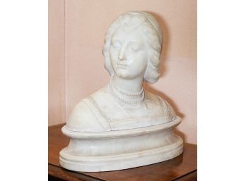 An Italian Carved Marble Bust Titled Laura