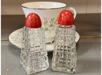 Vintage Glass Salt And Pepper Shakers With Red 'Bakelite' Plastic Lids