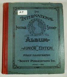 #23 The International Postage Stamp Album Junior Edition- About 25 Percent Full
