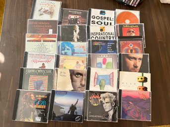24 Assorted CDs Including Bob Marley, Queen And More - L160