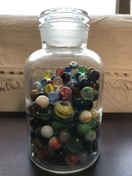 The Old Marble Collection In An Antique Apothecary Jar