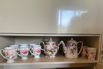 Set Of 10 - Two Tea Pots And 8 Floral Mugs - In Hutch