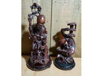 2 CARVED ASIAN STATUES