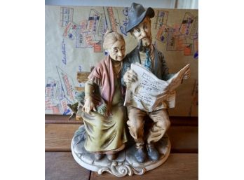 MAN & WOMAN ON BENCH PORCELAIN FIGURINE