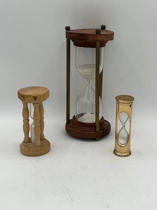 A Group Of Three Various Minute Timers