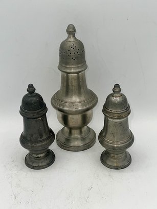 A Group Of Three Salt Shakers Made In England